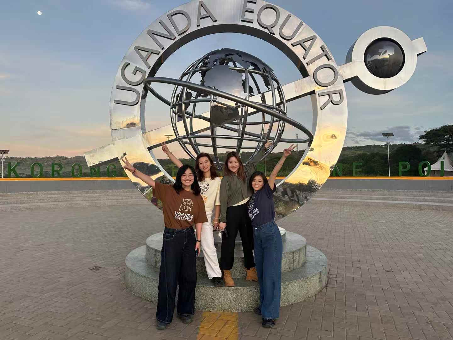 Visitors enjoying a stop at the Uganda Equator monument